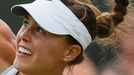 Michelle Larcher De Brito of Portugal serves to Maria Sharapova of Russia during their women's singles tennis match at the Wimbledon Tennis Championships, in London June