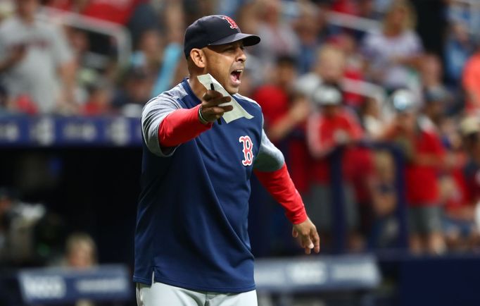 Jul 24, 2019; St. Petersburg, FL, USA; Boston Red Sox manager Alex Cora (20) comes out and reacts to umpires about the lineup change during the eighth inning against the