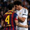Real Madrid's Pepe touches the neck of Barcelona's Cesc Fabregas during La Liga's second 'Clasico' soccer match of the season in Madrid