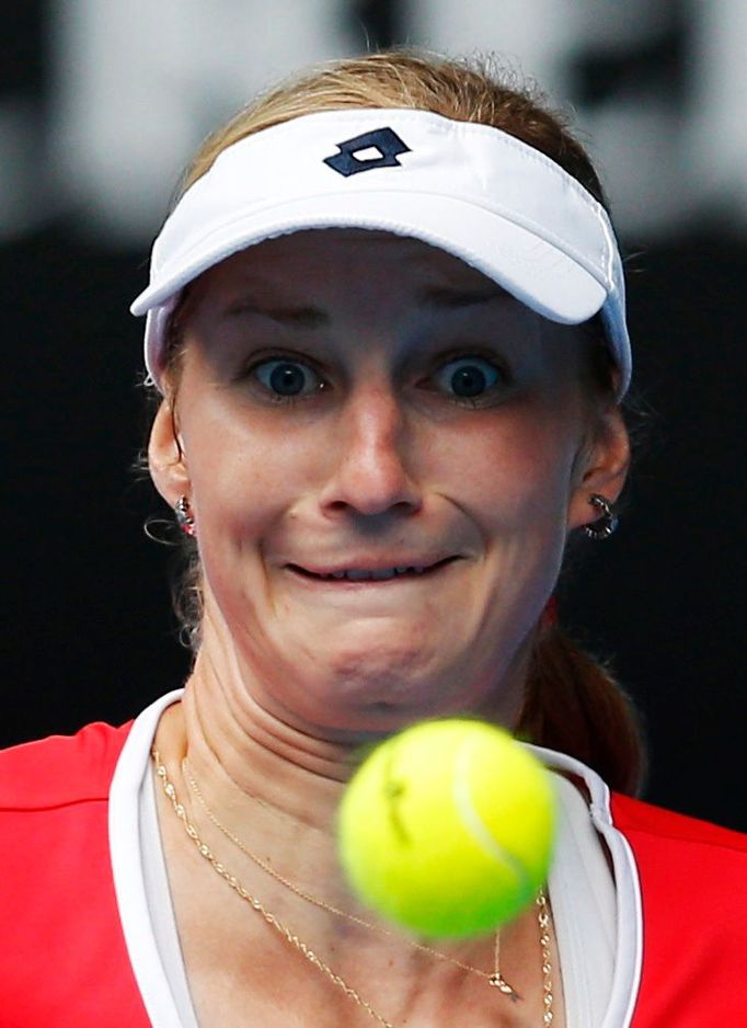 Ekaterina Makarova of Russia eyes the ball as she prepares to hit a return to Simona Halep of Romania during their women's singles quarter-final at the Australian Open 20