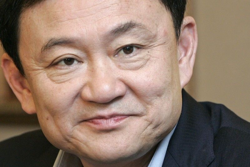 Thaksin Shinawatra během tiskové konference v Hong Kongu.