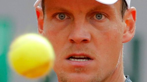 Tomas Berdych of the Czech Republic eyes the ball during his men's quarter final match against Ernests Gulbis of Latvia at the French Open Tennis tournament at the Roland