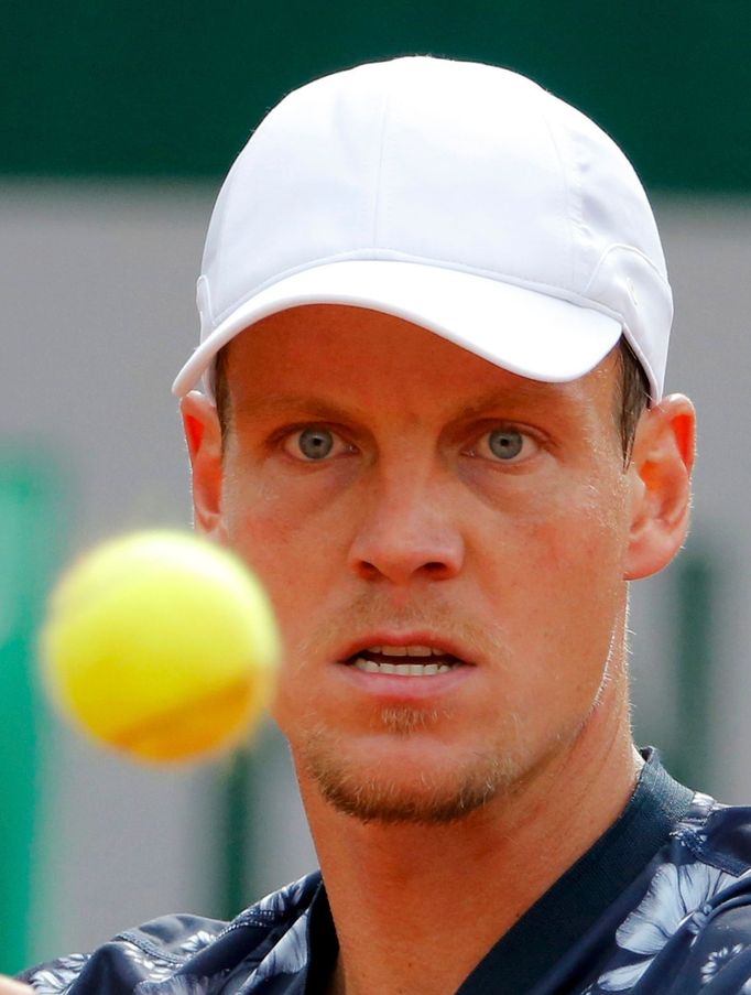 Tomas Berdych of the Czech Republic eyes the ball during his men's quarter final match against Ernests Gulbis of Latvia at the French Open Tennis tournament at the Roland