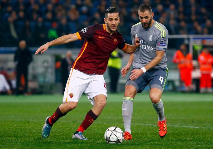 AS Roma's Kostas Manolas (L) in action with Real Madrid Karim Benzema