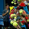Kokkinakis of Australia signs autographs for fans following his first round victory over Benneteau of France at the Brisbane International tennis tournament in Brisbane