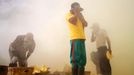 Sulfur miners risk health on Mount Ijen Jakarta, Indonesia. 24th October 2012 -- Miners cover their nose and eyes to avoid smoke that can cause tightness and pain in the