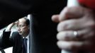 Hollande, French Socialist Party candidate for the 2012 presidential elections, reacts as he takes a local bus during a campaign visit in Vaulx-en-Velin