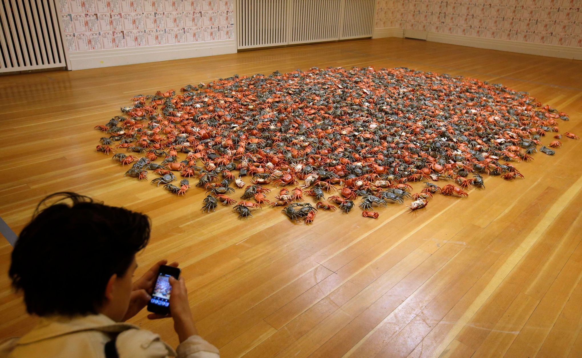 Woman takes a picture of installation &quot;He Xie&quot; by Chinese artist Ai Weiwei at the Martin-Gropius Bau in Berlin