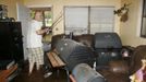 Troy Revis retrieves some fishing rods from his flooded home on County Road 137 in Wellborn, Florida, June 27, 2012. Revis said his family couldn't get flood insurance for the home because of a pond that was built behind it. "I'm sure will just bulldoze it and take a loss," he said. Tropical Storm Debby weakened to a tropical depression after it drifted ashore on Florida's Gulf Coast, even as it dumped more rain on flooded areas and sent thousands of people fleeing from rising rivers. REUTERS/Phil Sears (UNITED STATES - Tags: ENVIRONMENT DISASTER) Published: Čer. 27, 2012, 10:29 odp.