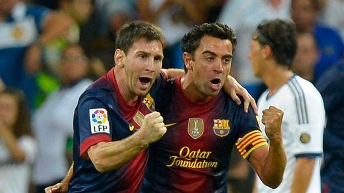 Lionel Messi a Xavi.