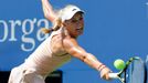 Caroline Wozniacki of Denmark hits a return to Maria Sharpova of Russia during their match at the 2014 U.S. Open tennis tournament in New York