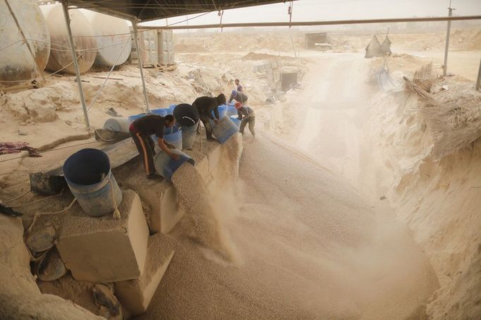 Egypt - Gaza - Palestinian Tunnel in Rafah Palestinian workers unload gravel being pulled from a smuggling tunnel between the Hamas-ruled Gaza Strip and Egypt in the southern Gaza Strip city of Rafah on April 3, 2013. The Egyptian army started to knock down Gaza smuggling tunnels last month after a high Egyptian court has urged the authorities in Cairo to tear down all the tunnels along the borders between Gaza and Egypt. Ismail Haniyeh discussed the Prime Minister of the Hamas government with Egyptian President Mohammed Mursi, a few days before the issue of smuggling tunnels. by Wissam Nassar.