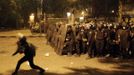 Riot policemen take cover from stones that were thrown by protesters during clashes with protesters along a road which leads to the U.S. embassy, near Tahrir Square in Cairo, September 13, 2012. Egypt's President Mohamed Mursi said on Thursday he supported peaceful protests but not attacks on embassies, after Egyptians angry at a film deemed insulting to the Prophet Mohammad climbed into the U.S. embassy in Cairo and tore down the U.S. flag. He pledged to protect foreigners in Egypt.