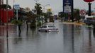 A car is seen in a flooded street following heavy rains, in Merida, Mexico, June 24, 2024. REUTERS/Lorenzo Hernandez