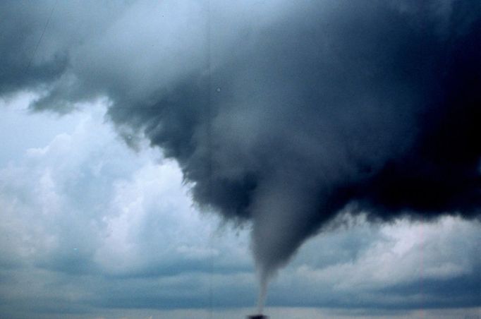 Project Vortex-99. An occluded mesocyclone tornado rated an F3 by an NWS damage survey. Occluded means old circulation on a storm; this tornado was forming while the new circulation was beginning to form the tornadoes which preceeded the F5 Oklahoma City tornado. Photo #1 of sequence. Oklahoma 10 miles south of Anadarko. May 3, 1999. Credit: OAR/ERL/National Severe Storms Laboratory (NSSL).