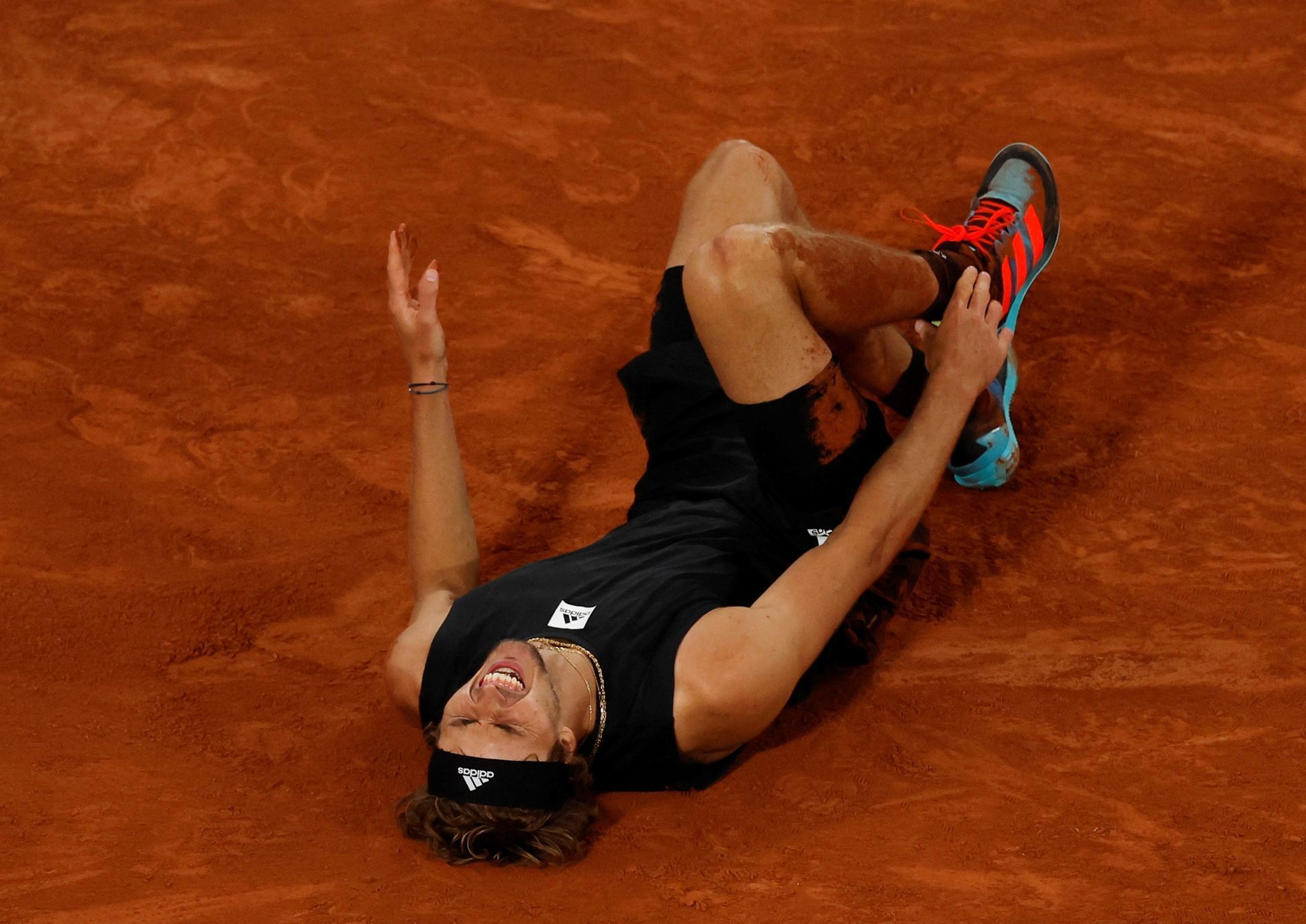 FILE PHOTO: Alexander Zverev reacts after sustaining an injury at French Open