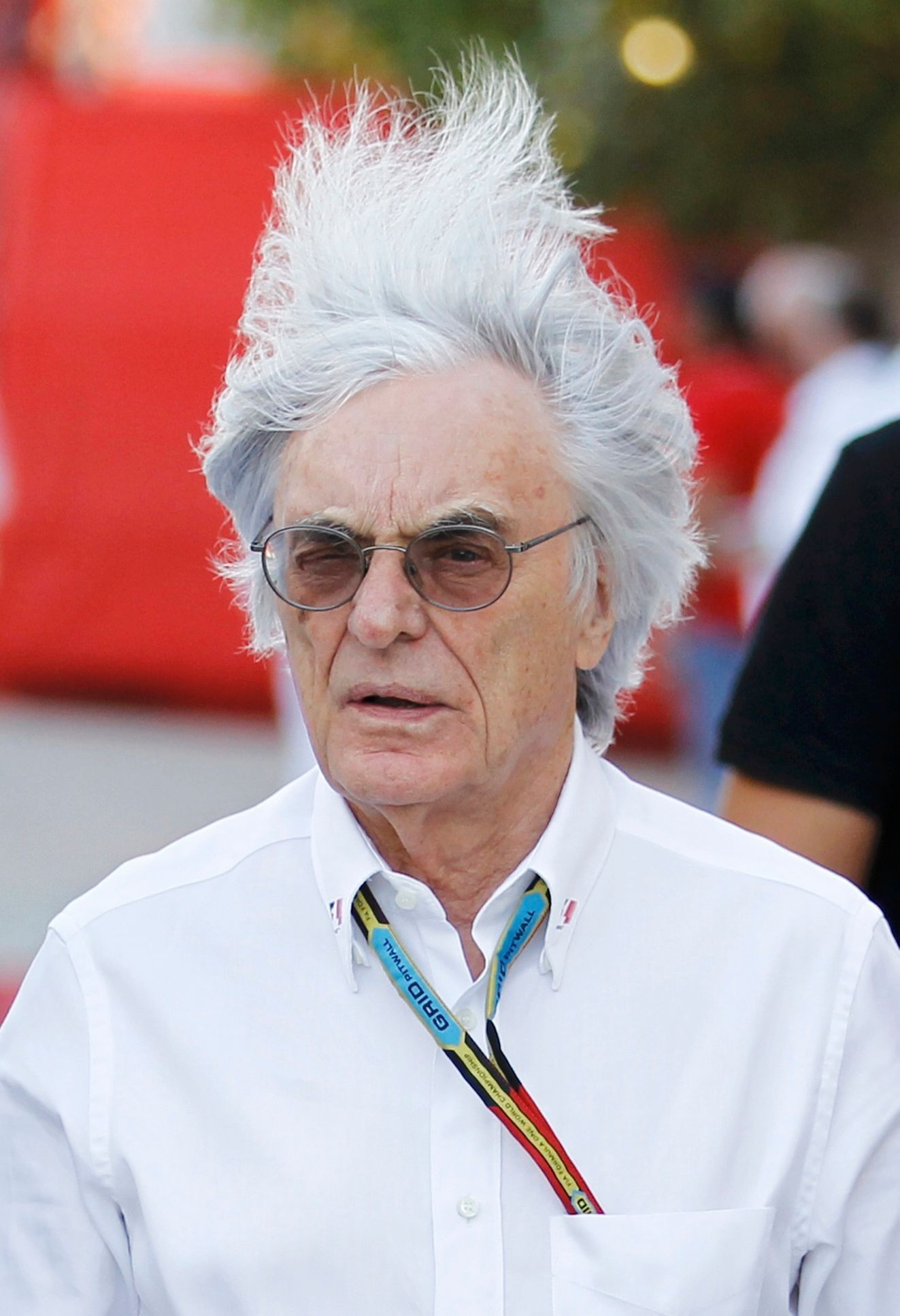 Formula One commercial supremo Bernie Ecclestone's hair blows in the wind as he walks at the paddock after the third practice session of the Bahrain F1 Grand Prix at the Bahrain International Circuit