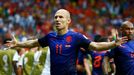 Arjen Robben of the Netherlands gestures as he celebrates after scoring a goal against Spain during their 2014 World Cup Group B soccer match at the Fonte Nova arena in S