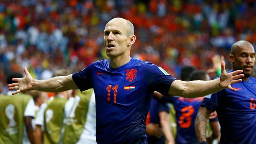 Arjen Robben of the Netherlands gestures as he celebrates after scoring a goal against Spain during their 2014 World Cup Group B soccer match at the Fonte Nova arena in S