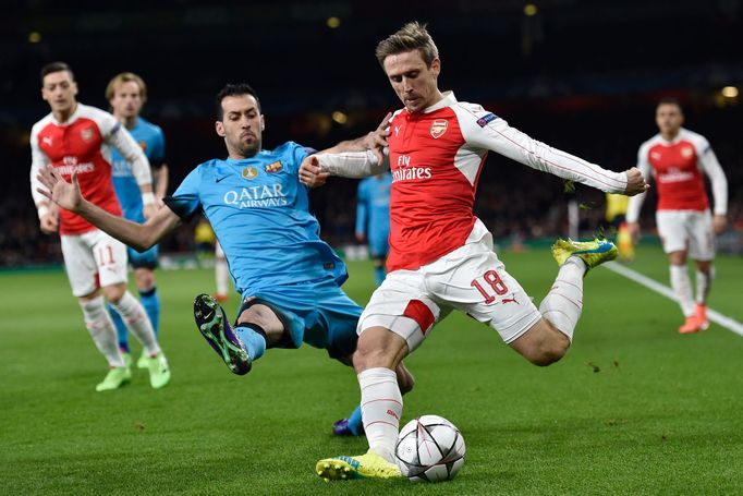 Barcelona's Sergio Busquets in action with Arsenal's Nacho Monreal