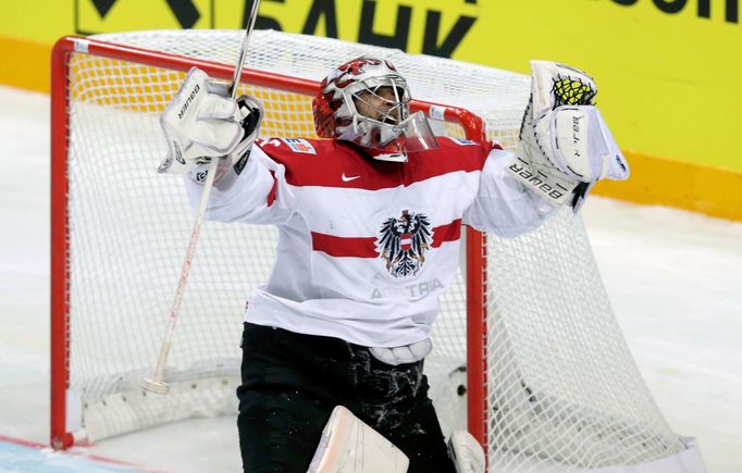 Austria's goaltender Bernhard Strakbaum celebrates after saving a shot at a penalty shootout during their Ice Hockey World Championship game at the O2 arena in Prague, Cz