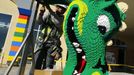 A worker prepares a dragon's head made of Lego bricks before it is hoisted into place as construction continues on North America's first ever Lego Hotel being built at Legoland in Carlsbad, California January 17, 2013. The three-storey, 250-room hotel will open April 5. REUTERS/Mike Blake (UNITED STATES - Tags: SOCIETY BUSINESS EMPLOYMENT TRAVEL) Published: Led. 17, 2013, 11:31 odp.