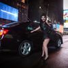 Halloween reveller smiles as she gets into a cab after waiting in Times Square for a taxi early in the morning in the Manhattan borough of New York