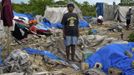 Haitian Janetta Lindsey, 46, stands in the exact location where her tent home once stood before it was destroyed during Tropical Storm Isaac in an area outside of Port-au-Prince August 26, 2012. Tropical Storm Isaac left six dead in Haiti, still recovering from a 2010 earthquake, and at least three missing in the Dominican Republic after battering their shared island of Hispaniola on Saturday. REUTERS/Swoan Parker (HAITI - Tags: DISASTER SOCIETY ENVIRONMENT) Published: Srp. 26, 2012, 5:42 odp.