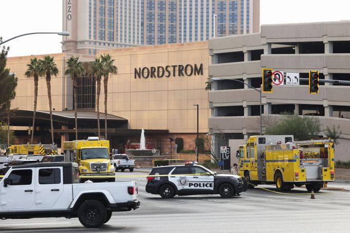 Firefighter vehicles are seen behind yellow tape in a cordoned area, after a Tesla Cybertruck burned at the entrance of Trump Tower, in Las Vegas, Nevada, U.S. January 1,