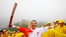 (080807) -- BEIJING, Aug. 7, 2008 (Xinhua) -- Torchbearer Zhang Jun runs with the torch during the Beijing 2008 Olympic Games torch relay in Beijing, China, Aug. 7, 2008. (Xinhua/Xing Guangli) (wh)