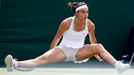 Caroline Garcia of France slips during her women's singles tennis match against Serena Williams of the U.S. at the Wimbledon Tennis Championships, in London June 27, 2013