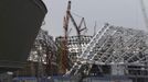 The Olympic stadium for the Sochi 2014 Winter Olympics is seen under construction at the seafront within the perimeters of the Olympic Park in Adler, near Sochi February 18, 2013. Although many complexes and venues in the Black Sea resort of Sochi mostly resemble building sites that are still under construction, there is nothing to suggest any concern over readiness. Construction will be completed by August 2013 according to organizers. The Sochi 2014 Winter Olympics opens on February 7, 2014. REUTERS/Kai Pfaffenbach (RUSSIA - Tags: BUSINESS CONSTRUCTION ENVIRONMENT SPORT OLYMPICS) Published: Úno. 18, 2013, 7:42 odp.