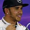 Mercedes Formula One driver Lewis Hamilton of Britain smiles during a news conference following the qualifying session of the Australian F1 Grand Prix at the Albert Park circuit in Melbourne