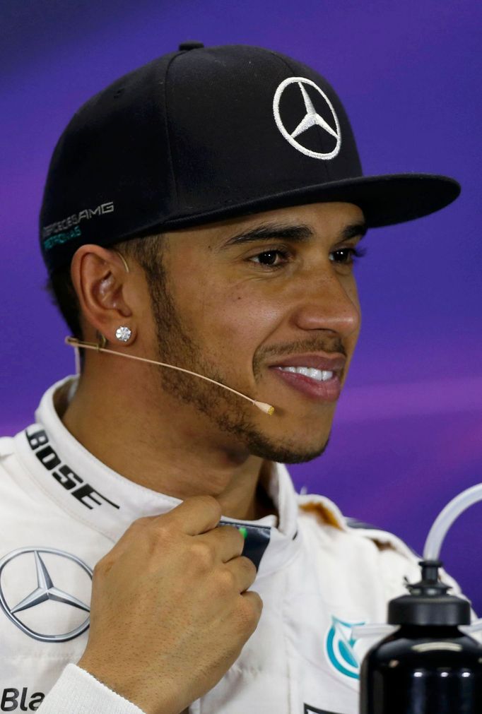 Mercedes Formula One driver Lewis Hamilton of Britain smiles during a news conference following the qualifying session of the Australian F1 Grand Prix at the Albert Park