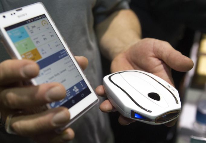 A Tao WellShell is displayed during "CES Unveiled," a media preview event to the annual Consumer Electronics Show (CES), in Las Vegas, Nevada, January 5, 2014. The WellShell is an electronic isometric device but also monitors various fitness levels and transmits the data to a smartphone.