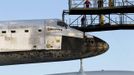 Space Center workers watch Discovery being towed at Kennedy Space Center in Cape Canaveral