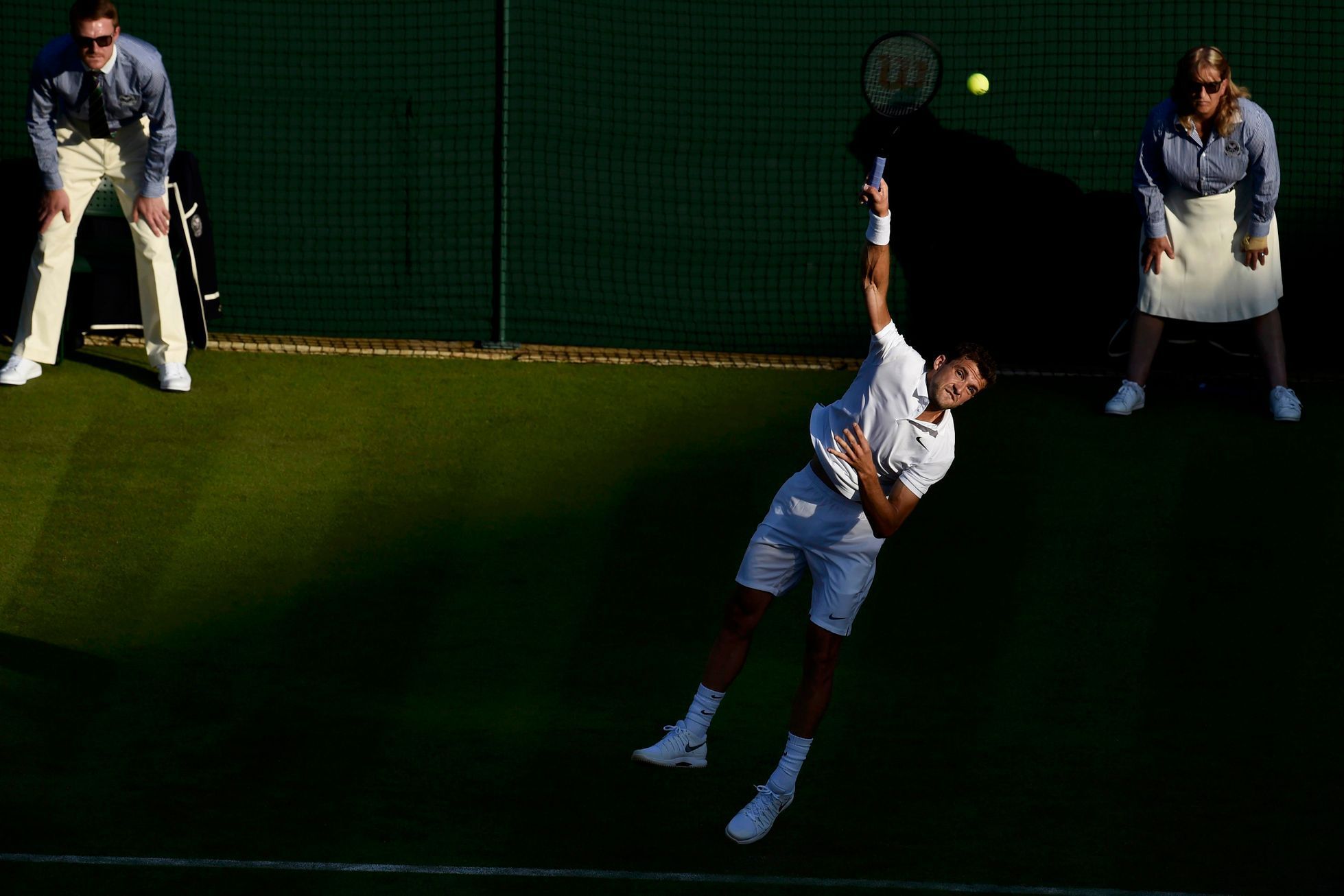 Grigor Dimitrov of Bulgaria serves during his match against Federico Delbonis of Argentina at the Wimbledon Tennis Championships in London