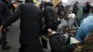 Anti-government protesters carry an injured man on a stretcher in Independence Square in Kiev February 20, 2014. Ukrainian anti-government protesters on Thursday seized b