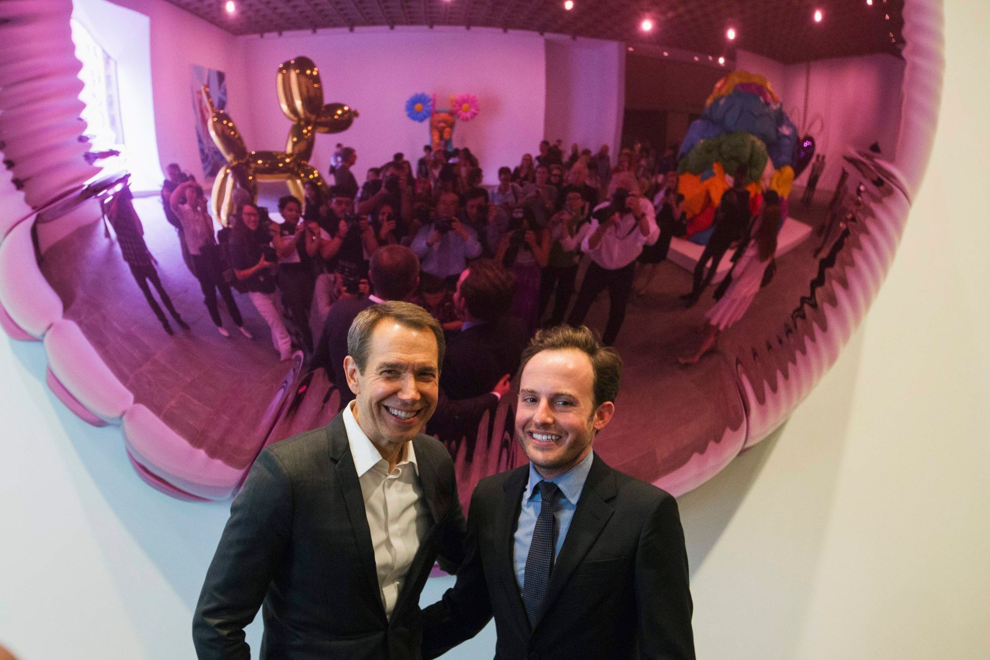 Artist Jeff Koons poses with Scott Rothkopf, the associate director of programs at the Whitney, at the Whitney Museum of American Art in New York