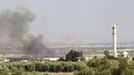 Smoke rises from Azaz vilage north of Aleppo, Syria, as seen from the Turkish-Syrian border in Oncupinar in Kilis province July 2, 2012. REUTERS/Osman Orsal (TURKEY - Tags: POLITICS CIVIL UNREST) Published: Čec. 2, 2012, 3:21 odp.