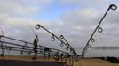 Loutjie Louwies of South Africa casts his fishing line during the 14th Carpfishing World Championship in Corbu village, 310 km (192 miles) east of Bucharest, September 29, 2012. REUTERS/Radu Sigheti (ROMANIA - Tags: SOCIETY) Published: Zář. 29, 2012, 4:29 odp.