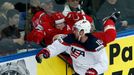 Jimmy Hayes of the U.S. (R) blocks Vladimir Denisov of Belarus (L) during the first period of their men's ice hockey World Championship Group B game at Minsk Arena in Min