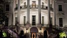 March 30, 2012 "We had just arrived aboard the Marine One helicopter on the South Lawn and the President was walking into the White House. I had seen this scene several times but had never been able to quite capture it the way I wanted. Here, finally, arriving at night, I was able to frame him walking into the light of the Diplomatic Reception Room, with the added bonus of his shadow being cast from the television lights off to the left."