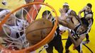 Miami Heat small forward LeBron James (6) is blocked out by San Antonio Spurs' Gary Neal (14) and Danny Green (R) as Chris Andersen (L) scores on Tim Duncan (21) during G