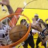 Miami Heat's James is blocked out by Spurs' Neal and Green a