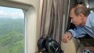 Russian president and British Prime minister meet in Sochi SOCHI, RUSSIA. MAY 10, 2013. President of Russia Vladimir Putin looks through a helicopter window as he is flying over the Sochi Olympic Park along the Black Sea coast in the Imeretinskaya Valley.