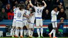 John Obi Mikel celebrates with team mates after scoring the first goal for Chelsea