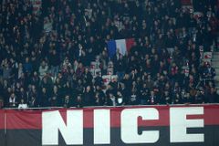 Supporters of Nice and Olympique Lyon teams observe a minute of silence to pay tribute to victims of last Friday's Paris attacks, before their French Ligue 1 soccer match