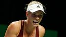 Caroline Wozniacki of Denmark screams after losing a point against Agnieszka Radwanska of Poland during their WTA Finals singles tennis match at the Singapore Indoor Stad