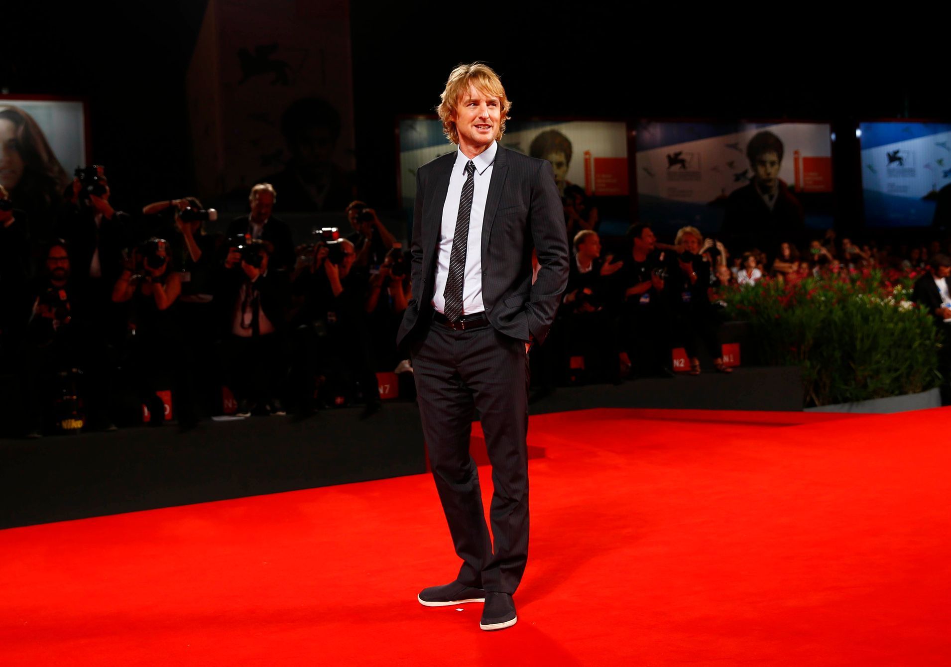 Actor Wilson poses during the red carpet for the movie &quot;She's Funny That Way&quot; at the 71st Venice Film Festival